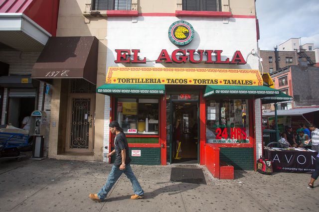 El Aguila: This mini-chain of restaurants covers all the bases when you're craving Mexican food, cooking up tacos, burritos, tamales and other staplesâand they do it 24 hours a day. Whenever they have it, go for the barbacoa tacos; tender goat meat topped with the requisite raw onion and cilantro inside two corn tortillas. They also do a solid chicken tamale, made even more delicious by employing all of the salsas from their self-service salsa bar. Warning: the bright orange salsa is muy picante so drizzle with care. El Aguila is located at 137 East 116th Street at Lexington Avenue, (212) 410-2450; elaguilanewyorkrestaurant.com